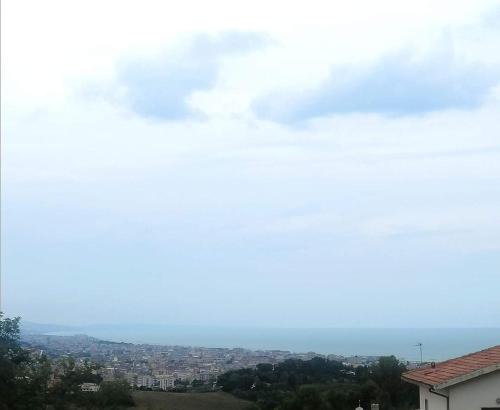 a view of a city with a cloudy sky at Villa Andrea B&B in San Silvestro