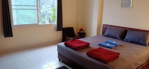 Postel nebo postele na pokoji v ubytování DoiTung Homestay ดอยตุงโฮมสเตย์