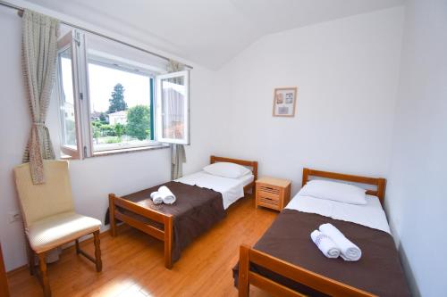 Ein Bett oder Betten in einem Zimmer der Unterkunft Apartment ViP