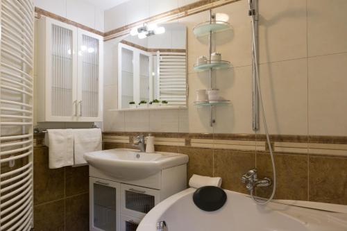 a bathroom with a sink and a mirror at Apartment Mario in Otočac