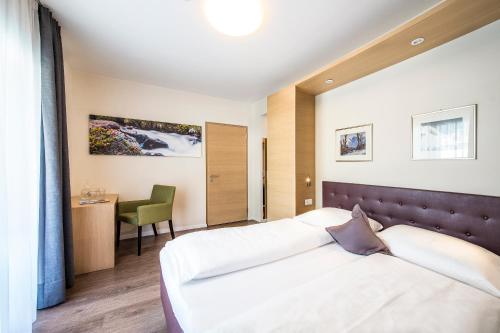 Postel nebo postele na pokoji v ubytování Hotel Jardis
