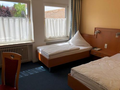 En eller flere senger på et rom på Hotel Haus am Rieth