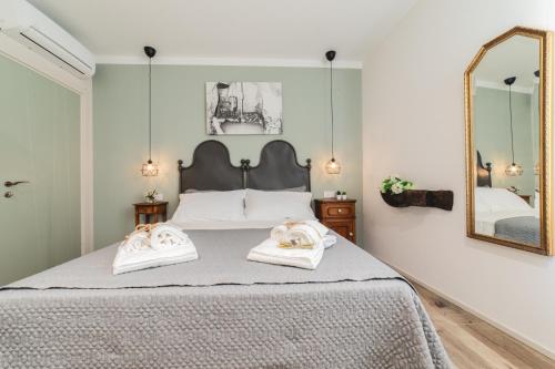 Säng eller sängar i ett rum på La Dimora del Mugnaio