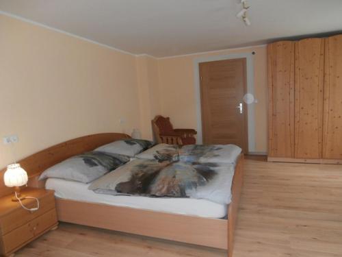 a bedroom with a bed with a blanket on it at Ferienwohnung Bluemelhube Wohnung Elisabeth in Vordernberg