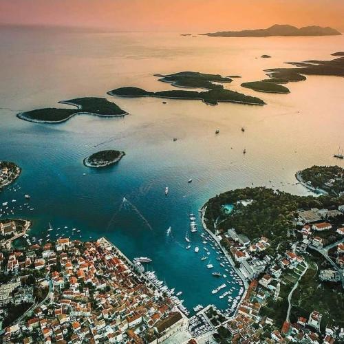 an aerial view of a harbor with boats in the water at Villa royale with shared pool in Hvar