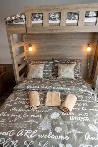 a large bed with two pillows on top of it at Orion in Starý Smokovec