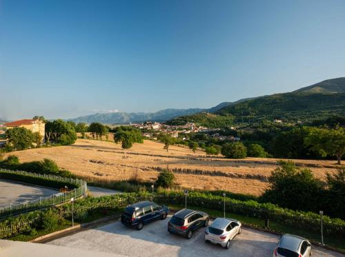 a group of cars parked in a parking lot at Hotel Hermitage in Polla