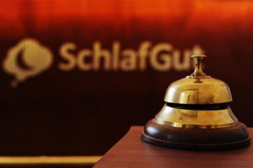 a bell sitting on top of a table at SchlafGut AppartementHotel in Leipzig