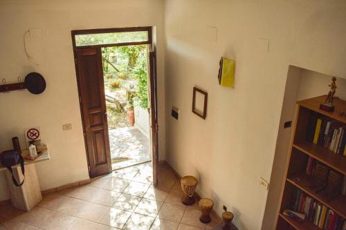 a hallway with a door open to aoyer with at Affittacamere D'amore in Foria