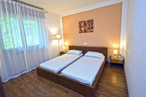 Ένα ή περισσότερα κρεβάτια σε δωμάτιο στο Apartment La Casa Nel Bosco