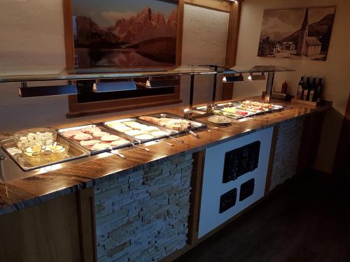 a buffet with many different types of food on display at Hotel Quehenberger in Maishofen