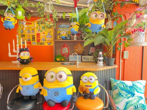 a group of toy figurines in a room at Hotel Orange House in Osaka