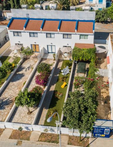 an overhead view of a building with a garden at Fig Tree Beach Houses in the heart of Protaras in Protaras