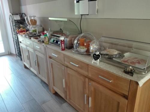 a kitchen with a counter with food on it at eden in Cannobio