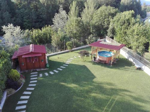 an aerial view of a yard with a house and a pool at eden in Cannobio