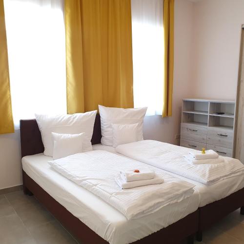 Ένα ή περισσότερα κρεβάτια σε δωμάτιο στο Apartments Oberschlesien