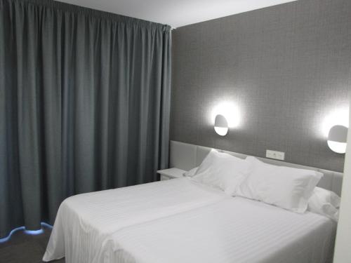 Cama o camas de una habitación en Hotel Ton