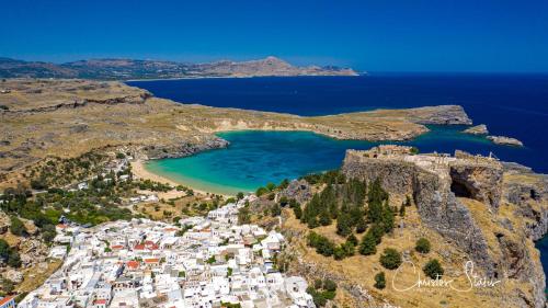 an aerial view of a small island with a beach at Lindos Villa Agape in Líndos