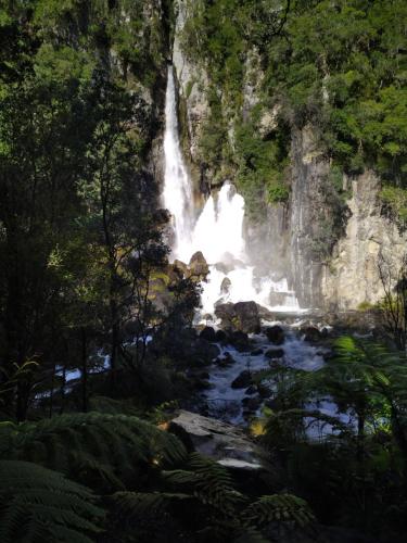 a waterfall in the middle of a river at Tarawera River Lodge Motel in Kawerau