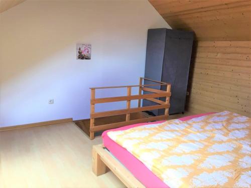 a bedroom with a bed and a bunk bed at Ferien Wohnung in der Eifel in Nideggen-Schmidt in Schmidt
