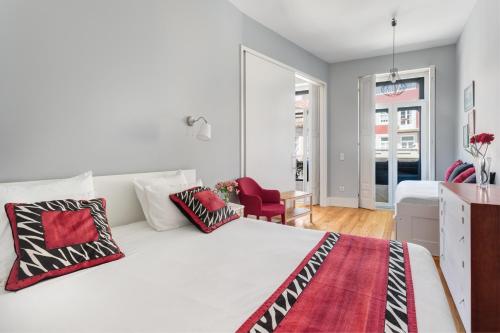 En eller flere senge i et værelse på Mouzinho 244 - Porto Houses & Suites