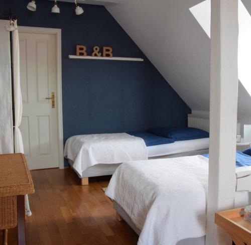 Ένα ή περισσότερα κρεβάτια σε δωμάτιο στο Bed & Breakfast Freiberg