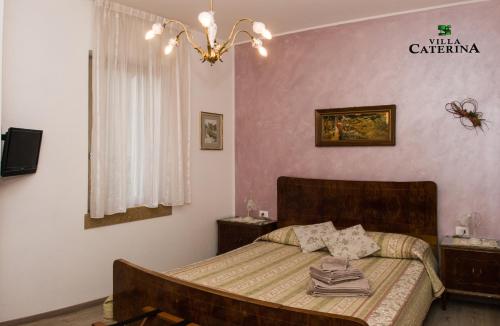 Voodi või voodid majutusasutuse B&B Villa Caterina toas