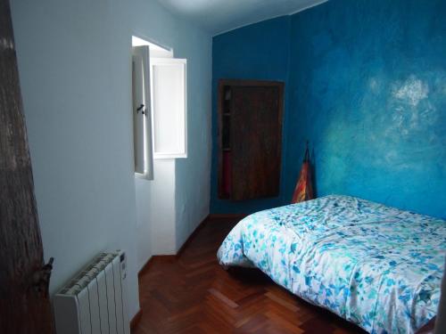 A bed or beds in a room at Casas de la Judería, judería nueva