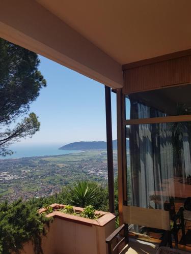 a balcony with a view of the ocean at Hotel Ristorante Radar in Carrara