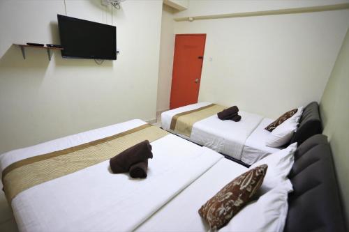 Cama o camas de una habitación en Camlodge Budget Hotel