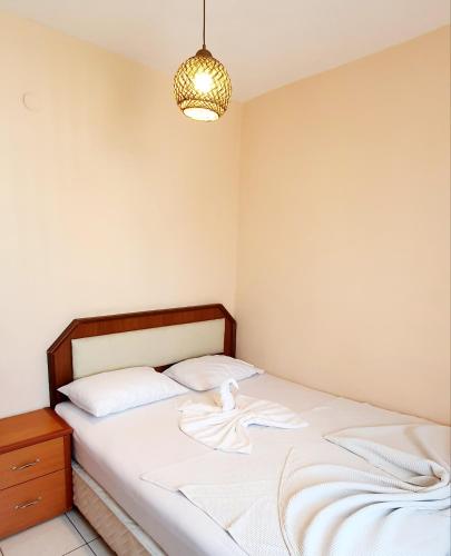 Ένα ή περισσότερα κρεβάτια σε δωμάτιο στο Palmen Apart Hotel