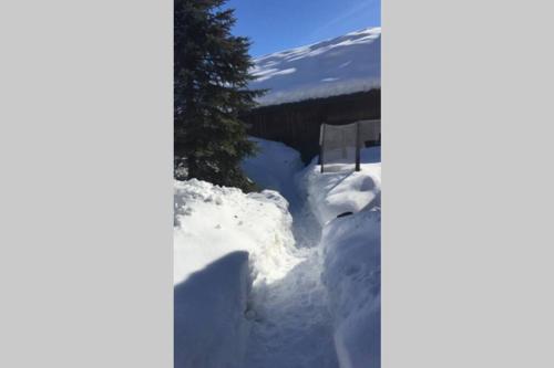 a pile of snow on the side of a house at Ferienwohnung Schönwörth in Niederbreitenbach