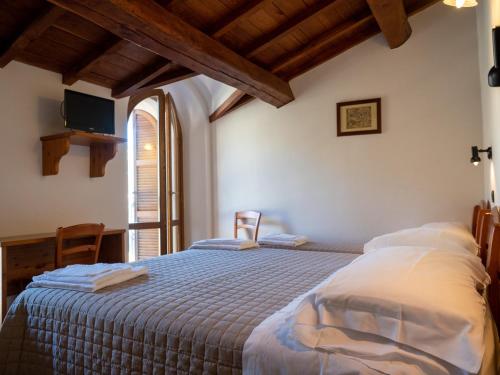 Posteľ alebo postele v izbe v ubytovaní Albergo Ristorante Terme