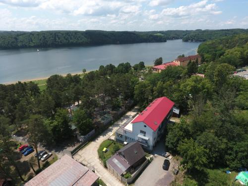 an aerial view of a house next to a river at Hotel U Pláže in Vranov nad Dyjí