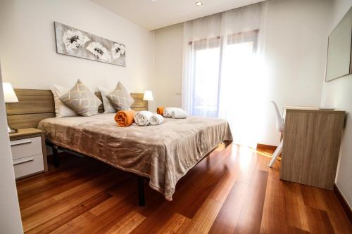 Ένα ή περισσότερα κρεβάτια σε δωμάτιο στο LUXURY APARTMENT - T2 vue sur piscine - PRAIA DA LUZ