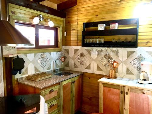 a kitchen with a sink and a counter top at Los Quetzales in Maldonado