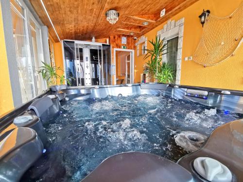 a pool of water in the middle of a room at Hel&eacute;na Hotel & SPA in Lev&eacute;l