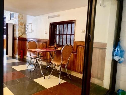 a dining room with a wooden table and chairs at Viet Nhat Halong Hotel - Bai Chay in Ha Long