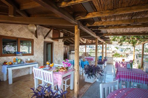 a dining room with a table and chairs at Papermoon Hotel & Apartments in Kalkan