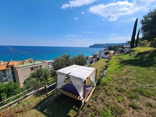 a view of the ocean from a hill with a tent at Soqquadro Art&Relax - Spotorno (SV) Sea View in Spotorno