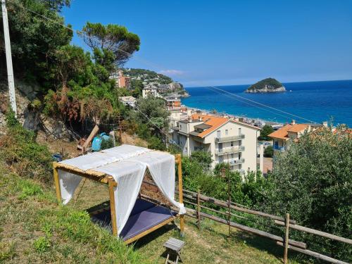 a tent on the side of a hill near the ocean at Soqquadro Art&Relax - Spotorno (SV) Sea View in Spotorno