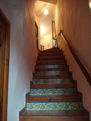 a set of stairs in a building at Casa de Amparo y José Manuel en Pavias in Pavías