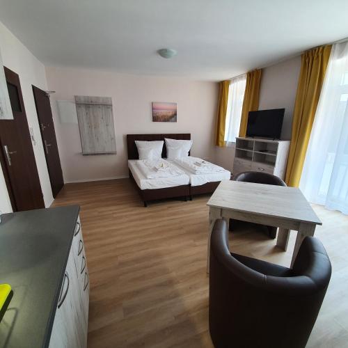 Ένα ή περισσότερα κρεβάτια σε δωμάτιο στο Apartments Oberschlesien