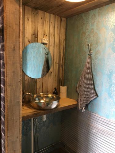 a bathroom with a sink and a mirror at Villa Kultaa in Kotka