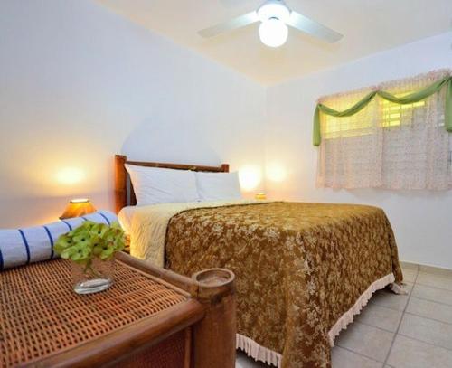 Cama o camas de una habitación en Aparta Hotel Las Flores