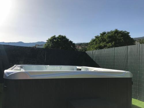 a bath tub sitting on top of a black fence at Casitas La Brenda y La Gaga in Los Realejos