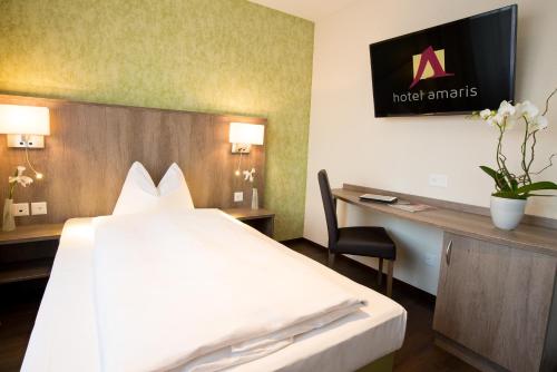 TV a/nebo společenská místnost v ubytování Hotel Amaris