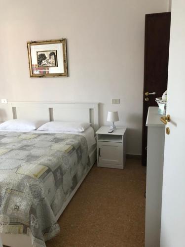Postel nebo postele na pokoji v ubytování B&B Amelia
