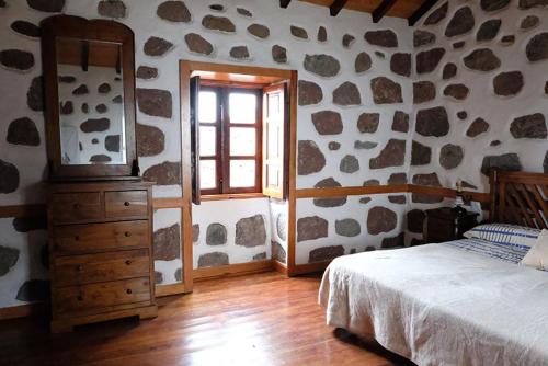Postelja oz. postelje v sobi nastanitve Casa Rural Isla de Cuba