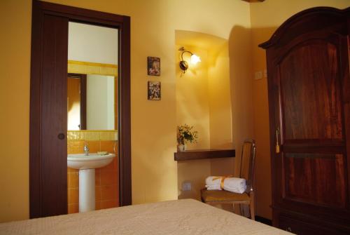 Łóżko lub łóżka w pokoju w obiekcie Agriturismo Al Crepuscolo